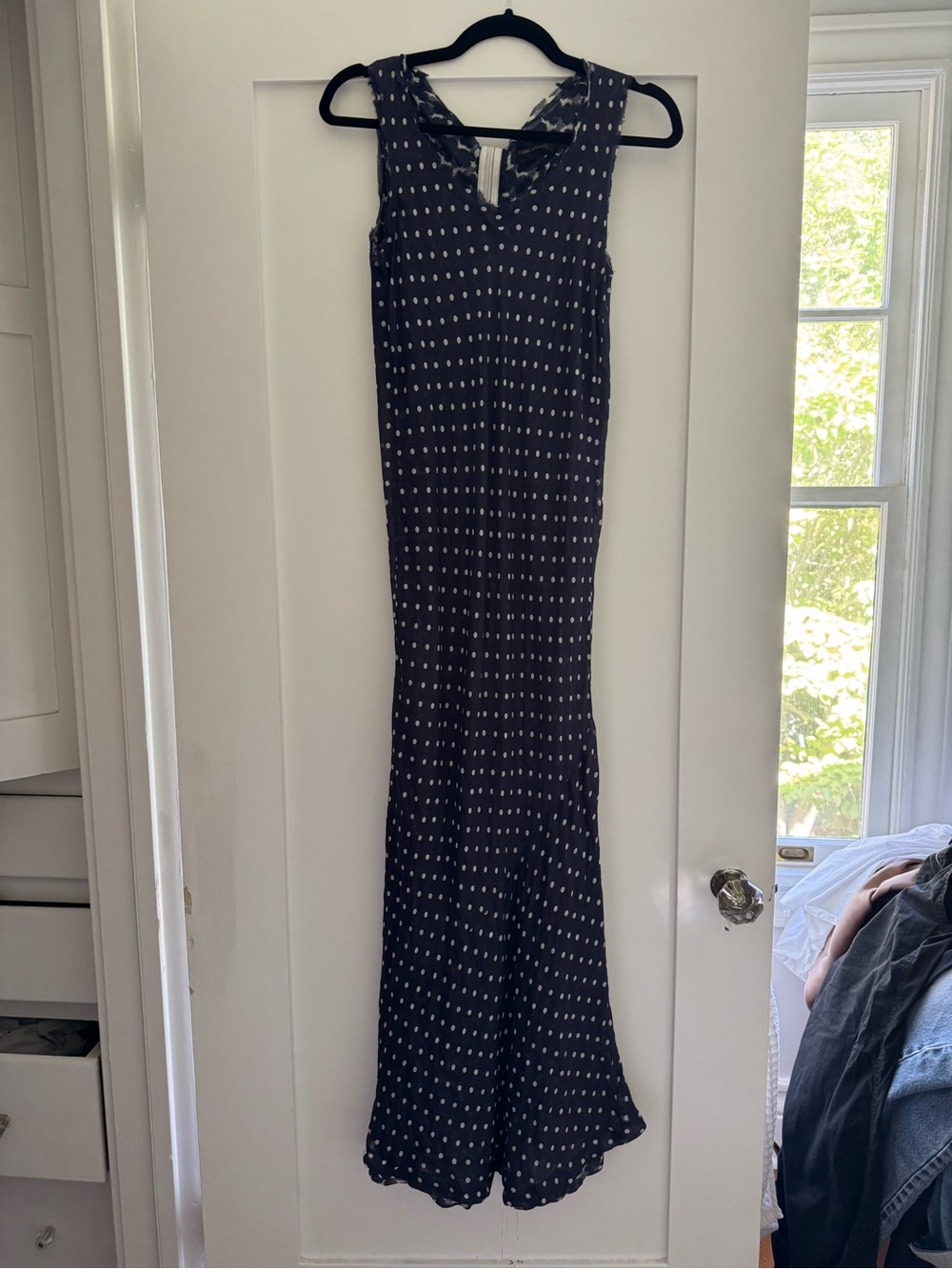 Sleeveless Navy Maxi Dress with White Polka Dot Pattern